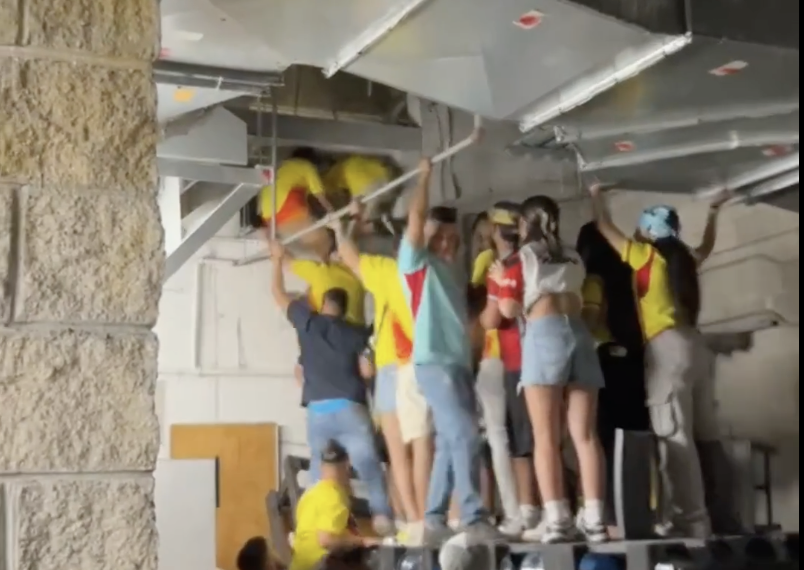 Copa america fans climb
